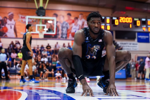 Memphis center Moussa Cisse stretches before an NCAA college basketball game against UConn at the Maui Invitational Monday, Nov. 25, 2024, in Lahaina, Hawaii. (AP Photo/Lindsey Wasson)