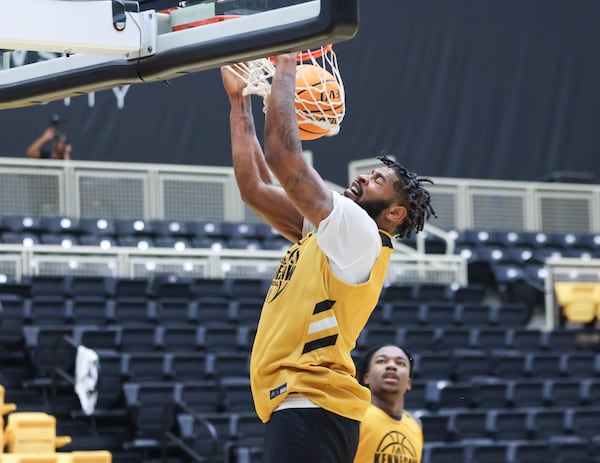 Kennesaw State University forward Demond Robinson dunks during practice at the Convocation Center on the Kennesaw State University campus, Tuesday, October 24, 2023, in Kennesaw, Ga. (Jason Getz / Jason.Getz@ajc.com)