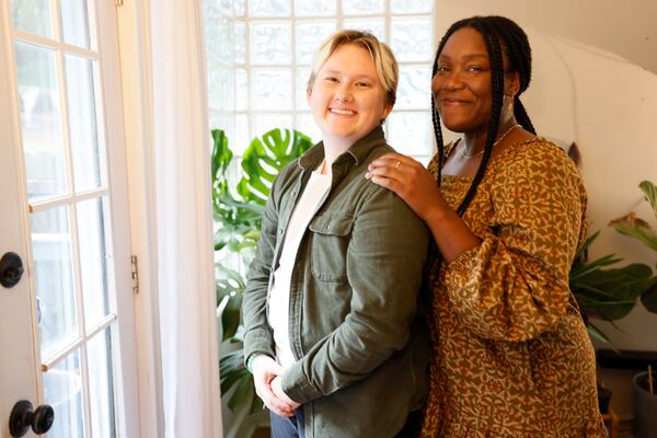 Event producer Sidney Hayes (right) and her partner, Chelsea Hoag, a Content Marketing Manager, pose in their living room at their home in Atlanta. They are planning to invite close to thirty people to their house for a Friendsgiving gathering with the idea of bringing people together when they cannot reunite with families for the holidays. Miguel Martinez / miguel.martinezjimenez@ajc.com