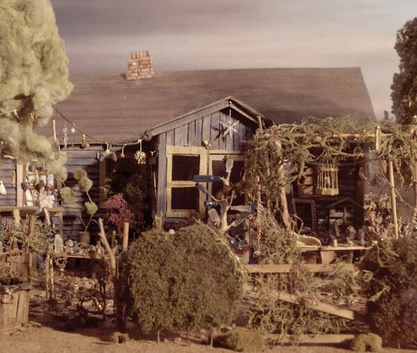 This miniature "reimagining" of Nellie Mae Rowe's "playhouse," her art-filled home and yard in Vinings, was created for the documentary film "This World Is Not My Own." The High Museum acquired some of the miniature sets built for the movie and one of the sets is currently on display accompanying the traveling show "Really Free: The Radical Art of Nellie Mae Rowe," which was curated by the High. Photo: courtesy High Museum of Art