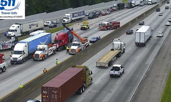 Three tractor-trailers and a Toyota Corolla were involved in a chain-reaction crash Friday afternoon on I-285 North at Paces Ferry Road, according to the Georgia State Patrol.