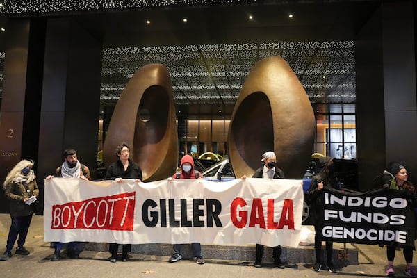 Protesters form a picket line outside the venue where the Giller Prize award ceremony is taking place, in Toronto, Monday, Nov. 18, 2024. (Chris Young/The Canadian Press via AP)