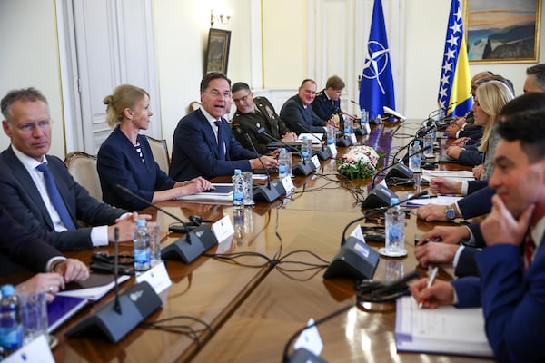 NATO Secretary General Mark Rutte, third left, talks with the members of the Bosnian Presidency at the start of their meeting in Sarajevo, Bosnia, Monday, March 10, 2025. (AP Photo/Armin Durgut)