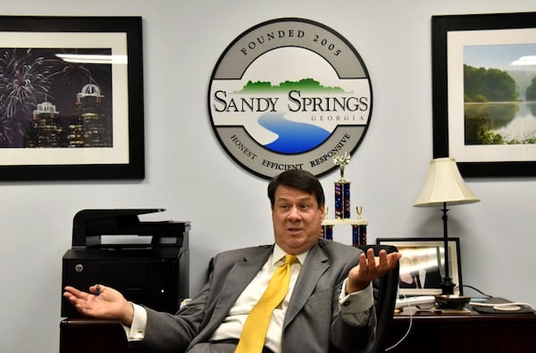 Sandy Springs Mayor Rusty Paul says creating a healthy retail environment and affordable housing in the city’s north end is a top priority. The public is invited to an open house July 25 to talk about that goal. HYOSUB SHIN / AJC