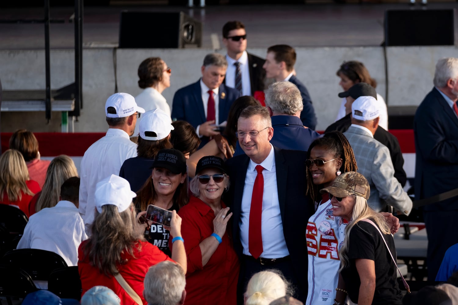 Rep. Doug Collins poses for a photo with fans before a rally for former President Donald Trump in Macon on Sunday, Nov. 3, 2024.   Ben Gray for the Atlanta Journal-Constitution