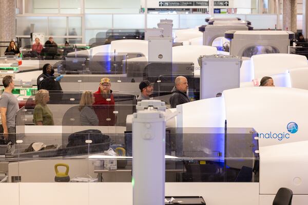 Travelers pass through security screening in the domestic terminal at Hartsfield-Jackson in Atlanta on Thursday, December 14, 2023. (Arvin Temkar / arvin.temkar@ajc.com)