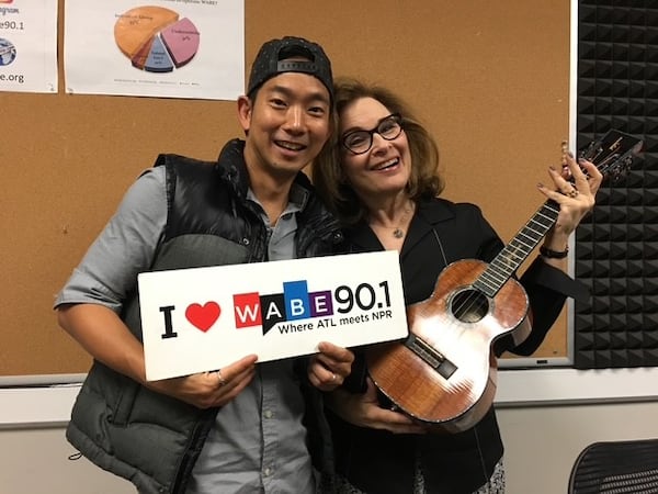 Ukulele star Jake Shimabokuro poses with Lois Reitzes after being interviewed.