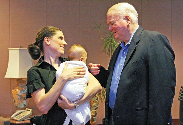 Nancy Mace visits with her fellow Citadel graduate Pat Conroy during his 2009 visit to Atlanta. Her daughter Ellison, a baby in this photo, is now 6. AJC file photo