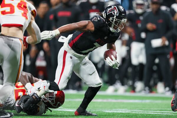 Atlanta Falcons running back Bijan Robinson (7) is tackled for a loss by Kansas City Chiefs linebacker Nick Bolton (32) for no gain on the fourth-and-1 play that ended the Falcons' possession during the fourth quarter at Mercedes-Benz Stadium, Sunday, Sept. 22, 2024, in Atlanta. The Falcons lost 22-17. (Jason Getz / AJC)