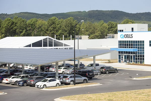 The Hanwha Q Cells solar manufacturing facility in Dalton started production earlier this year. A solar array covers a portion of its parking lot. (Alyssa Pointer/alyssa.pointer@ajc.com)