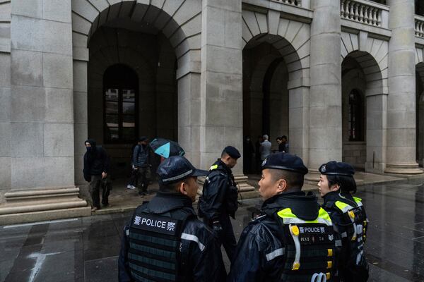 Police officers stand guard outside the Court of Final Appeal in Hong Kong, Thursday, March 6, 2025. Three former organizers of Hong Kong's annual vigil in remembrance of the 1989 Tiananmen Square crackdown won their bid at the top court on Thursday to overturn their conviction over their refusal to provide information to police, marking a rare victory for the city's pro-democracy activists. (AP Photo/Chan Long Hei)