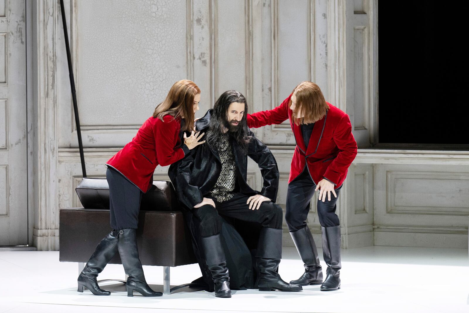 Bass David Leigh, center, appears with Daniel Schmutzhard, right, and Lauren Fagen in Wagner's "Götterdämmerung" at the Zurich Opera on Oct. 31, 2023. Leigh, an operatic bass, is the son of Mitch Leigh, who wrote the score for the musical “Man of La Mancha." This month he’ll take on a major role as the jailer Rocco in a new production of Beethoven’s only opera, “Fidelio,” at the Washington National Opera, opening Friday. (Monika Rittershaus via AP)