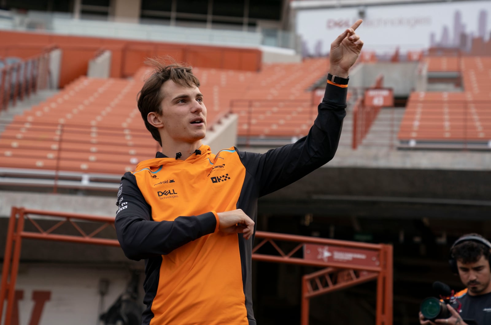 Formula One driver Oscar Jack Piastri of Australia, a member of Team McLaren, tours Darrell K Royal-Texas Memorial Stadium earlier this week. The U.S. Grand Prix is being competed 16.8 miles away from where No. 1-ranked Texas and the No. 5 Georgia Bulldogs were playing Saturday night in Austin. (Photo by Aidan Smith/Texas Athletics)