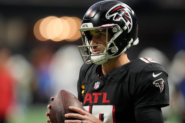 Atlanta Falcons quarterback Kirk Cousins (18) warms up before an NFL football game against the Los Angeles Chargers on Sunday, Dec. 1, 2024 in Atlanta. (AP Photo/Mike Stewart)