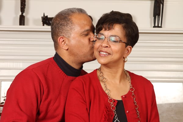 Lisa Young Alston gets a kiss from her husband of 38 years, Douglas Alston. (Courtesy of Casey Wright)