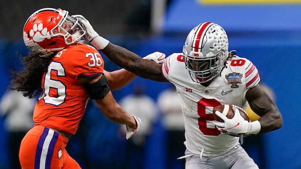 Ohio State running back Trey Sermon runs past Clemson safety Lannden Zanders during the first half of the Sugar Bowl Friday, Jan. 1, 2021, in New Orleans. (Gerald Herbert/AP)