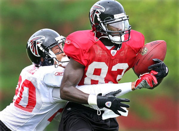 Cornerback Brent Grimes breaks up a pass to wide receiver Harry Douglas.