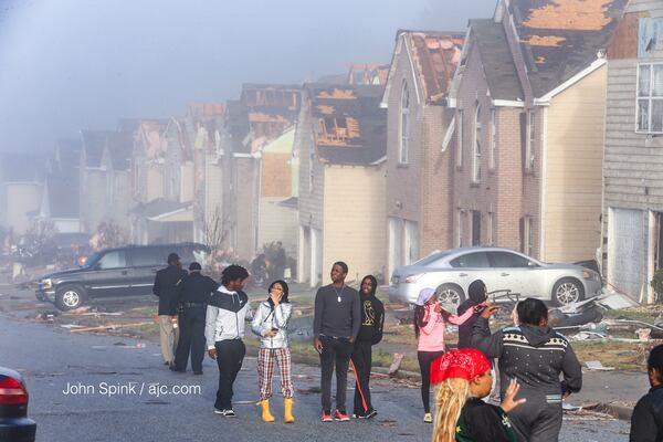 Residents of the Jumpers Trail neighborhood awoke to devastation from the previous night's storm. JOHN SPINK / AJC