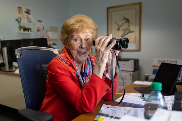 Alana Shepherd, founder of Shepherd Center, reacts while demonstrating how she uses binoculars to view new construction at the Shepherd Center in Atlanta on Tuesday, March 12, 2024. (Arvin Temkar / arvin.temkar@ajc.com)