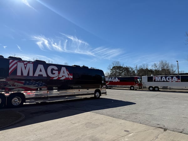 The owner of a tour bus company is taking seven buses of Trump supporters who paid $900 each to ride in a caravan from Atlanta to Washington on Friday.