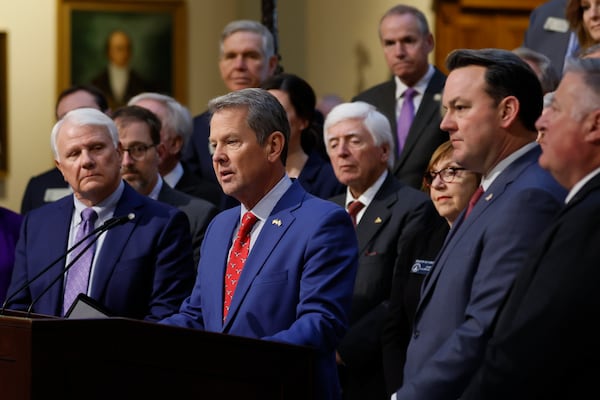 Gov. Brian Kemp (center) speaks during a news conference at the Georgia Capitol’s north wing on Wednesday, Jan. 15, 2025. Kemp wants to expand Medicaid to cover parents of young children. (Miguel Martinez/AJC)