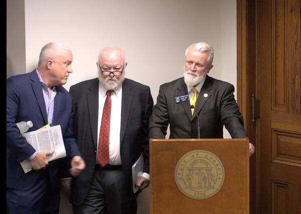 Bill White, a leader of the Buckhead cityhood movement, left, confers with Republican state Sen. Randy Robertson, right, at a recent Senate committee meeting. The leaders of the effort to split Atlanta into two municipalities have called it quits “for now” after last week's legislative loss. (Image via state Senate video)