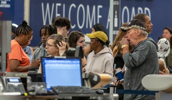 Delta Air Lines employees were busy Wednesday, July 24, 2024, at Hartsfield-Jackson International Airport. By Wednesday, operations started to recover from a meltdown that left hundreds of thousands of travelers stranded around the country over the previous several days. (John Spink/AJC)