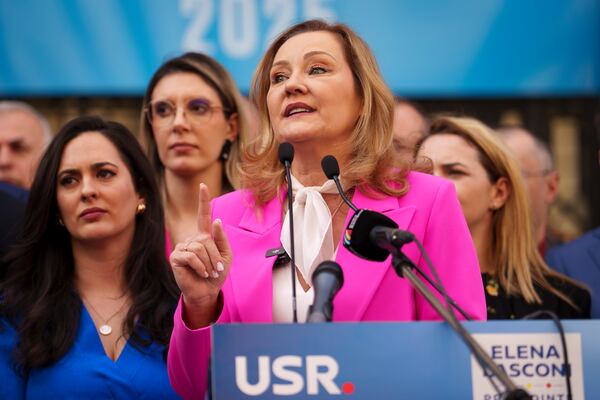 Elena Lasconi, presidential candidate for the Save Romania Union (USR) party, gestures outside the electoral authority after registering her bid to enter the May presidential election rerun in Bucharest, Romania, Thursday, March 13, 2025. (AP Photo/Vadim Ghirda)