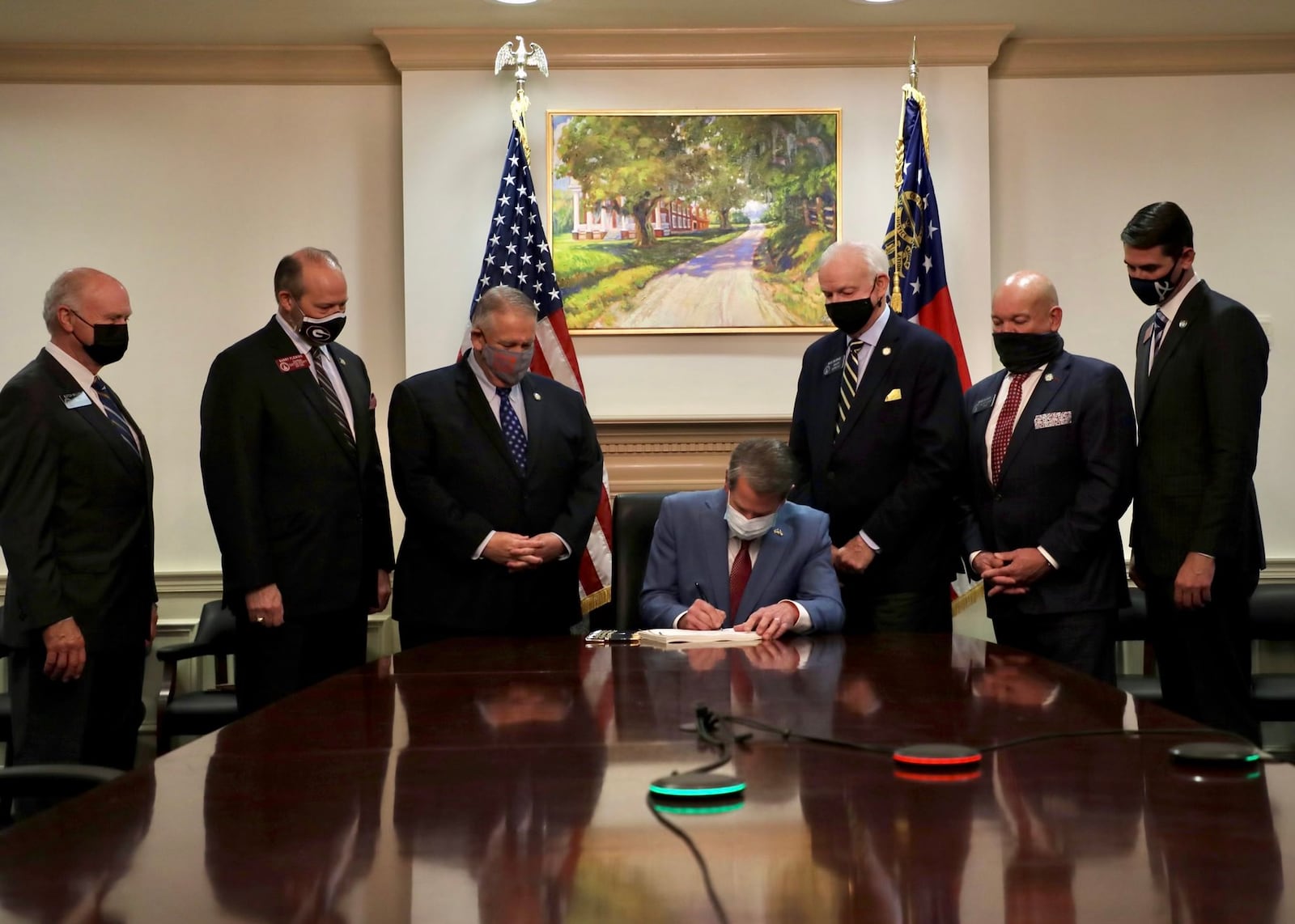 Gov. Brian Kemp, behind closed doors at the Georgia Capitol, signs into law Senate Bill 202, a 2021 overhaul of the state's election law that followed Republican Donald Trump's loss in the 2020 presidential election.