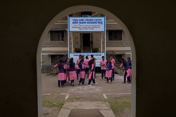 Students enrolled for professional training courses interact during a break, at the campus of the Swami Vivekananda Youth Movement, a nongovernmental organization that works to help poor and Indigenous communities, in Kenchanahalli, India, Monday, Sept. 23, 2024. (AP Photo/Aijaz Rahi)