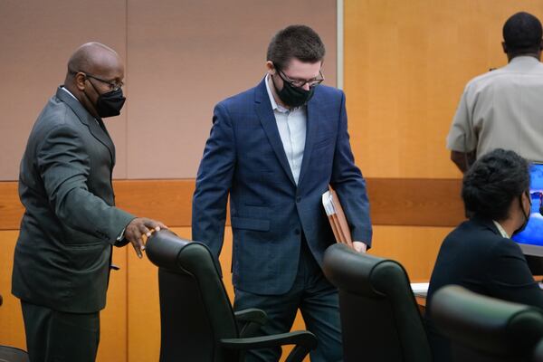 Robert Aaron Long enters a Fulton County courtroom Tuesday morning before pleading not guilty.