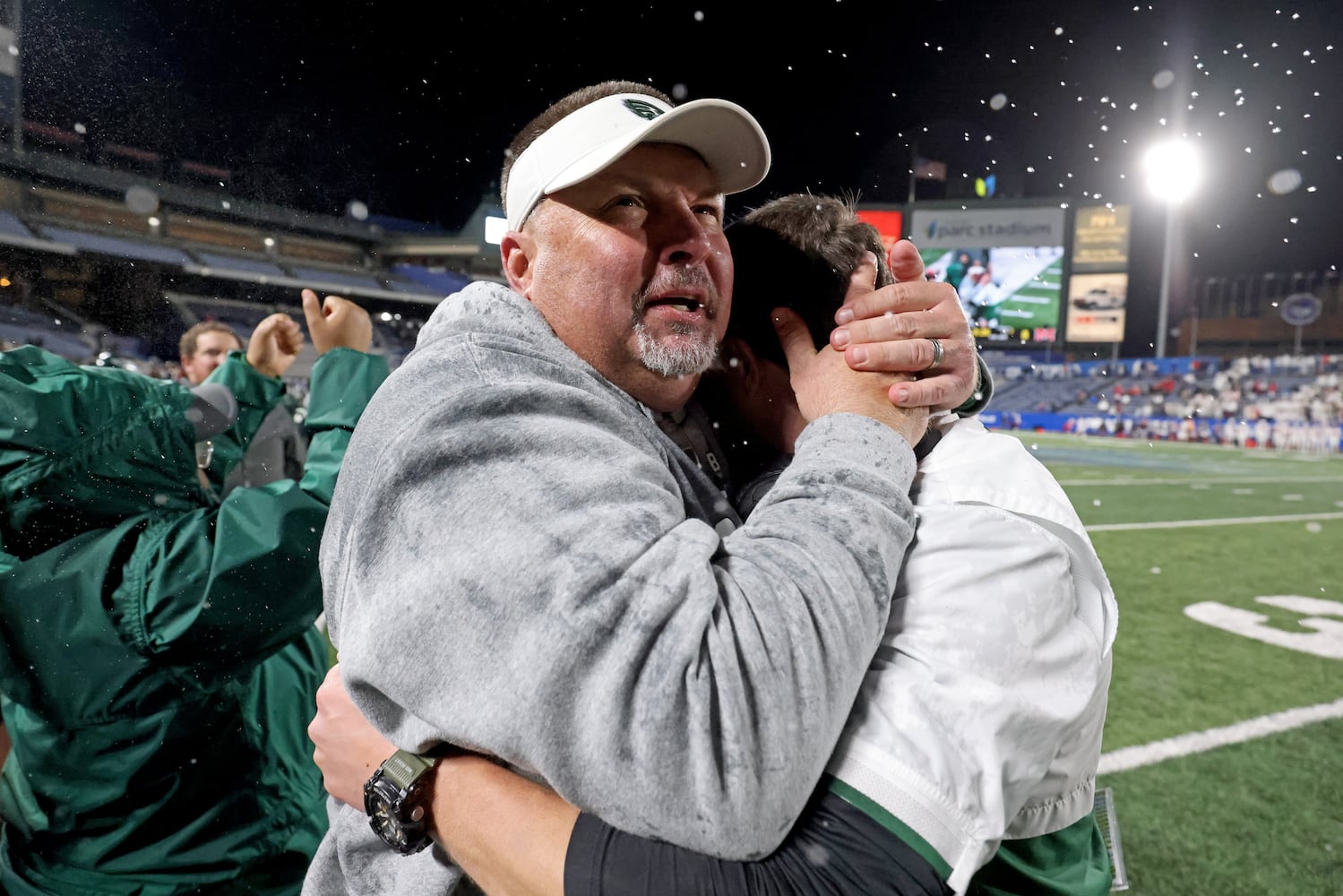 Collins Hill head coach Lenny Gregory, left, celebrates with defensive coordinator Drew Swick in the closing minute of their 24-8 win against Milton in the Class 7A state title football game at Georgia State Center Parc Stadium Saturday, December 11, 2021, Atlanta. JASON GETZ FOR THE ATLANTA JOURNAL-CONSTITUTION