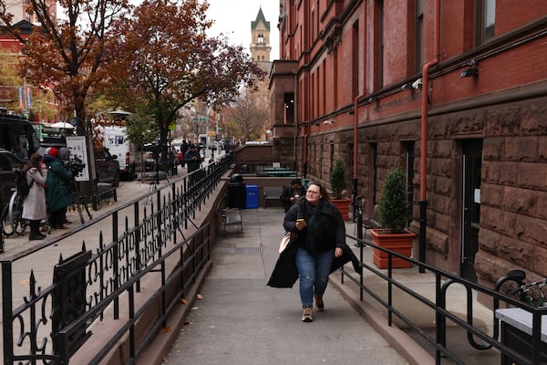 Members of the media line a sidewalk outside the HI New York City hostel, Thursday, Dec. 5, 2024, in New York, where police say the suspect in the killing of UnitedHealthcare CEO Brian Thompson may have stayed. (AP Photo/Yuki Iwamura)