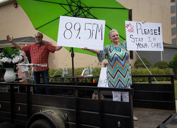 Missy Osbon and her husband, Pastor Shell Osbon, greet the crowd at the beginning of the Drive-in church service at the Life Church Smyrna Assembly of God Sunday, April 5, 2020. STEVE SCHAEFER / SPECIAL TO THE AJC