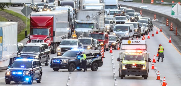 On the inner loop, traffic was backed up for miles behind another wreck at Glenwood Road. A pedestrian was hit and killed, and the driver involved stayed at the scene, police said. All southbound lanes were closed at 5:30 a.m. and started reopening two hours later. Two predawn crashes made a mess of things Monday, June 20, 2022 on I-285 in DeKalb County, shutting down both the inner and outer loops for hours during the morning commute. (John Spink / John.Spink@ajc.com)