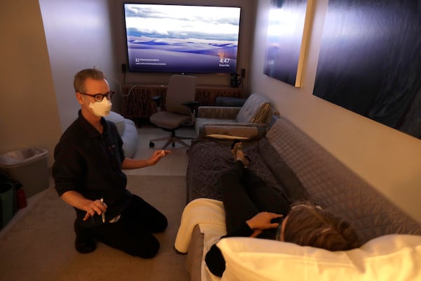 Dr. Keith Heinzerling speaks with Melanie Senn before a psilocybin session on Feb. 24 at the Pacific Neuroscience Institute. (Genaro Molina/Los Angeles Times/TNS)