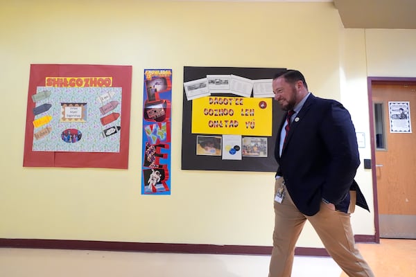 Rice Intermediate School Principal Nicholas Ferro walks to a classroom at Rice Intermediate School Tuesday, Aug. 27, 2024, in San Carlos, Ariz. (AP Photo/Ross D. Franklin)