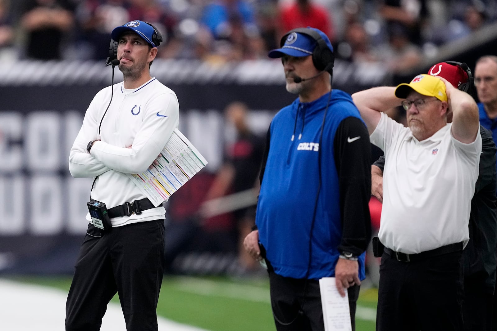 Indianapolis Colts head coach Shane Steichen, left, watches from the sideline during the first half of an NFL football game against the Houston Texans, Sunday, Oct. 27, 2024, in Houston. (AP Photo/Tony Gutierrez)