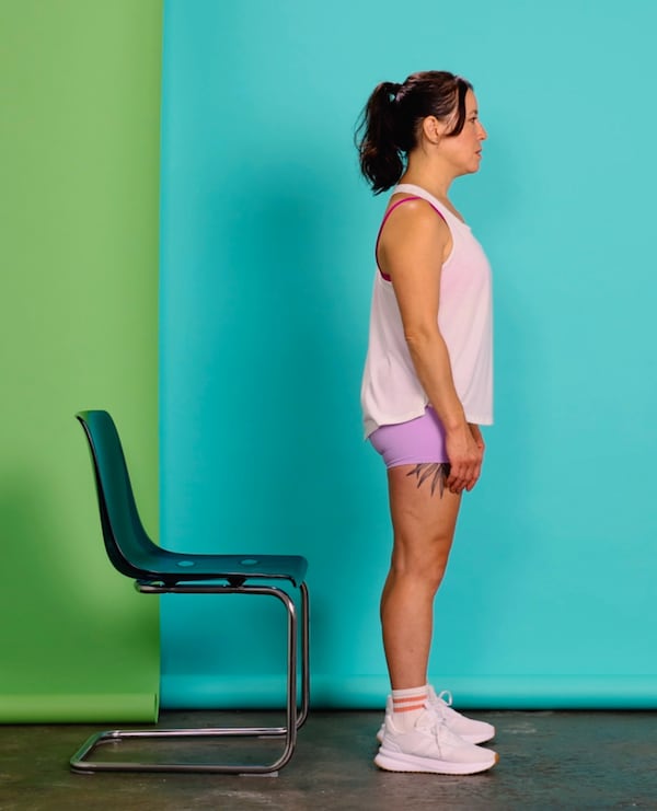 An object like a chair might help you gauge distance when performing a shallow(er) squat, which is recommended for Patellofemoral pain (kneecap pain), osteoarthritis and post-anterior cruciate ligament (ACL) reconstruction surgery, in New York, Aug. 26, 2024. Most people can effectively squat while navigating all sorts of issues, like kneecap pain, arthritis, meniscus tears, ligament and tendon strains and postoperative recovery. (Gritchelle Fallesgon/The New York Times)