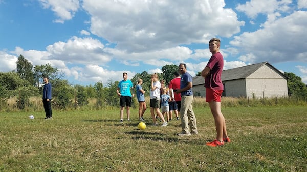 One afternoon, a group of Americans and their new Polish friends gathered for a game of soccer. It was here, on this soccer field, in the small Polish village of Redzynskie, where Irene Devine, a 21-year-old college student from Missouri, slipped off her sneakers and gave them to 8-year-old Veronika Kawka so that she could join her brothers and friends in an impromptu match. CONTRIBUTED BY MARGARET WILKOFF