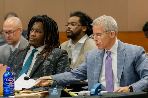 Atlanta rapper Young Thug, whose real name is Jeffery Williams, listens to Judge Peige Resse Withaker as his defense attorney, Brian Steel, goes through documents during a motion hearing at the Fulton County Courtroom on Tuesday, July 30, 2024.

(Miguel Martinez / AJC)