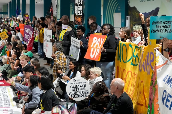 Activists participate in a demonstration at the COP29 U.N. Climate Summit, Saturday, Nov. 16, 2024, in Baku, Azerbaijan. (AP Photo/Rafiq Maqbool)