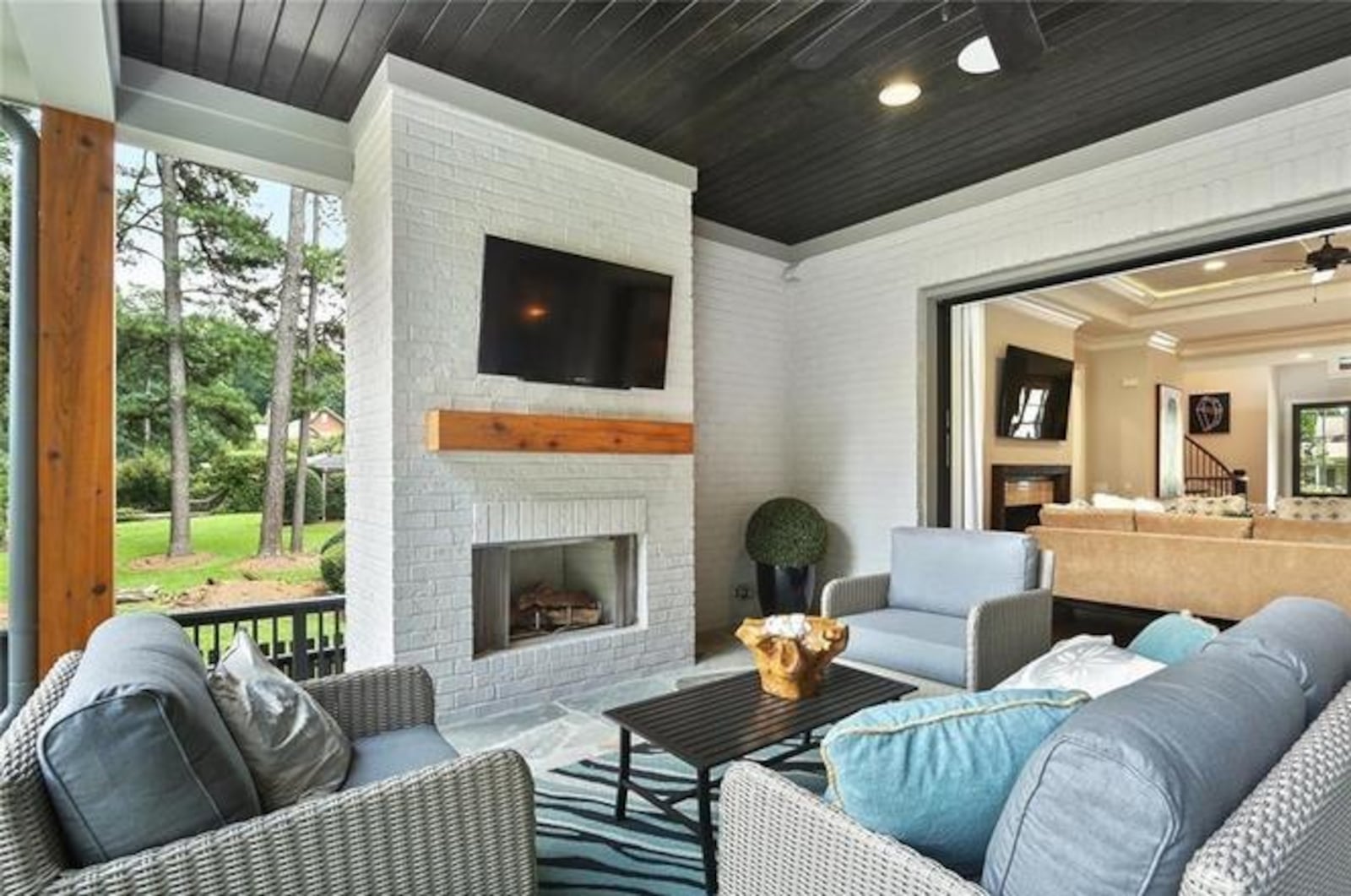 The property has an outdoor fireplace, perfect for entertaining guests.