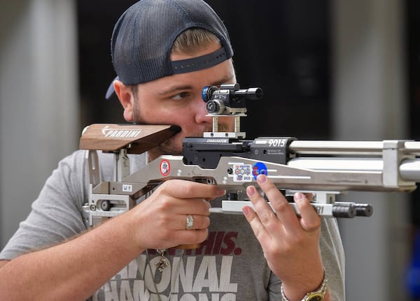 Ledger-Enquirer reporter Kelby Hutchison shoots an air rifle at Ft. Moore. (Photo Courtesy of Darrell Roaden/Ledger-Enquirer)