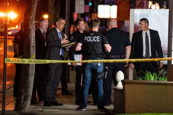 Law enforcement respond to the scene of a shooting that left four people dead at an office building in Orange County on Wednesday. (Kent Nishimura/Los Angeles Times/TNS)