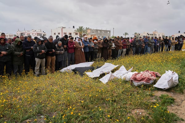 Palestinians pray during a funeral for victims of Israeli army strikes in Khan Younis, southern Gaza Strip, Thursday, March 20, 2025. (AP Photo/Abdel Kareem Hana)