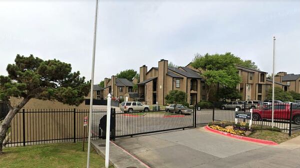 Pictured in a March 2019 Street View image is an entrance of the Monterra Pointe Apartments in Arlington, Texas, where a newborn baby was found Saturday, Sept. 21, 2019, in a suitcase by the trash compactor. The compactor can be seen at far left.