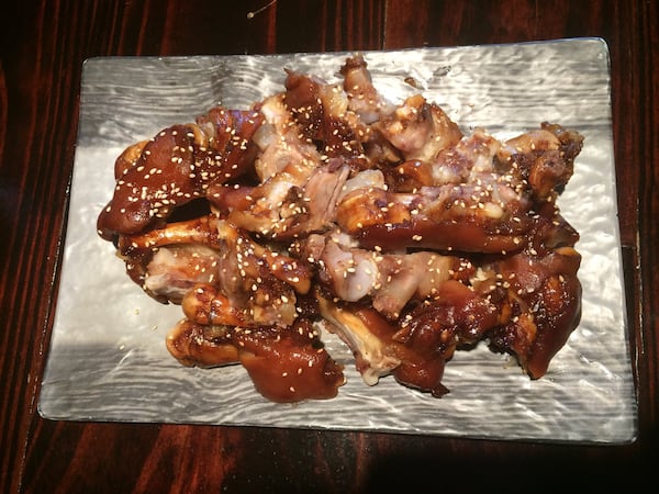 The mini jokbal (pig’s feet) at Next Door is served warm and sprinkled with sesame seeds. CONTRIBUTED BY WENDELL BROCK