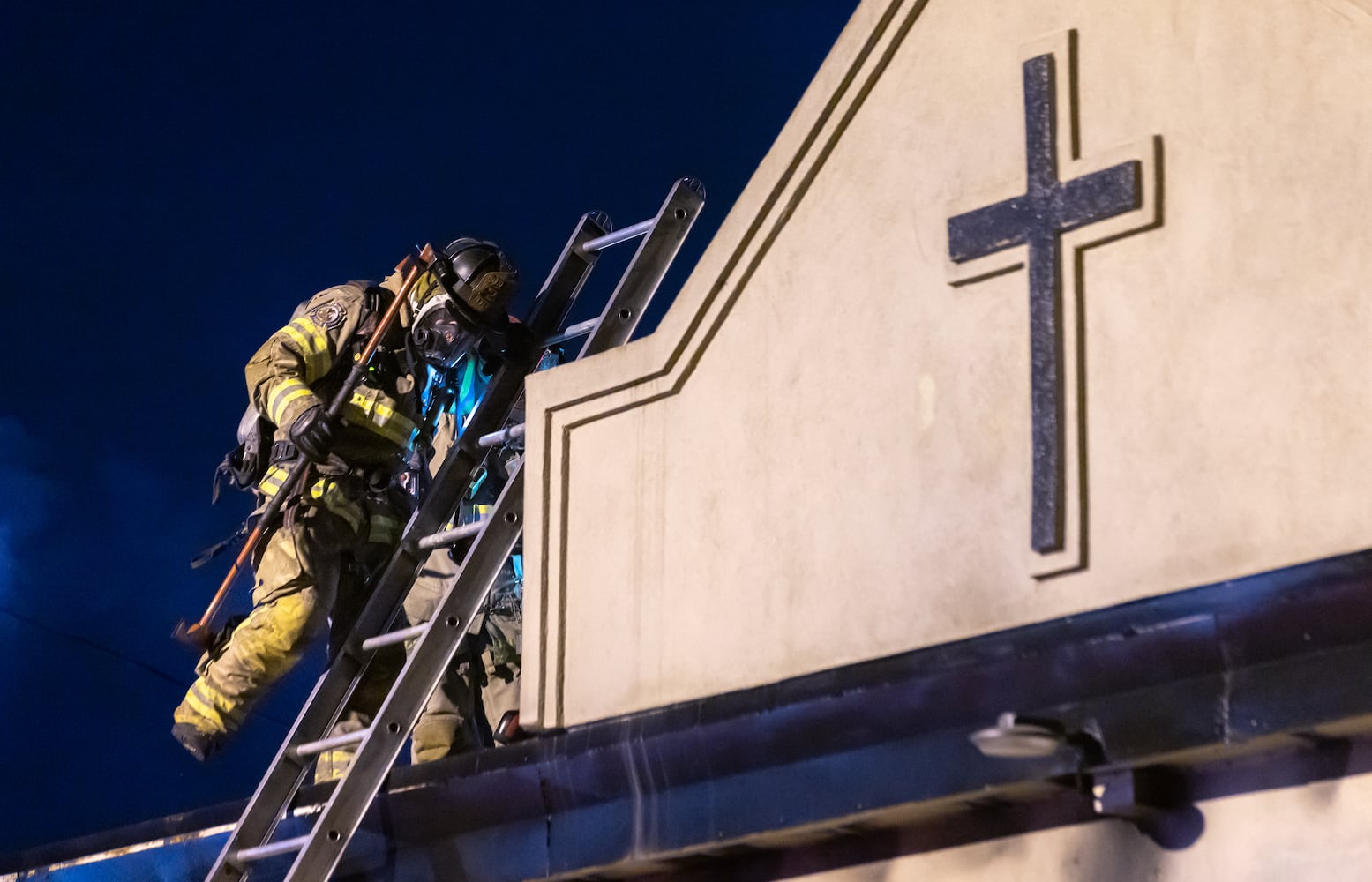 DeKalb County firefighters battle a blaze at the Celestial Citizens Global church on Richard Road on Friday, April 19, 2024. No one was injured, and the cause remains under investigation. The blaze damaged one-third of the structure, and the rest of the property sustained smoke and water damage, authorities said. (John Spink/AJC)