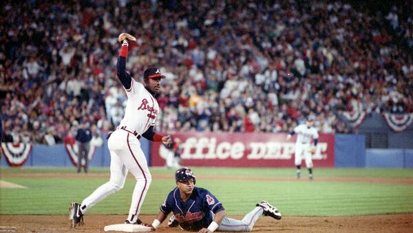 Braves first baseman Fred McGriff handles a high pick-off throw in Game 2 of the World Series Oct. 22, 1995, in Atlanta.